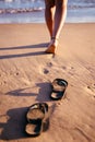 A woman`slegs walking into the ocean